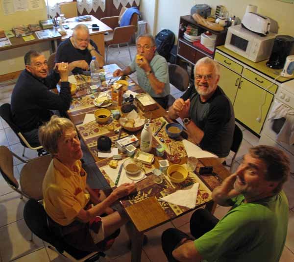 Gîte breakfast with fellow walkers and the resident guardians, Sorges