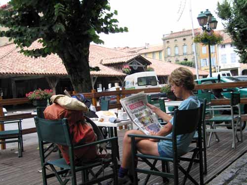 Reading the local paper over a coffee and pastry, Revel Reading the local paper over a coffee, Revel
