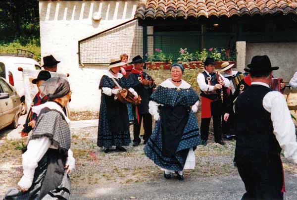 Walking in France: Folk dancers at the flower festival in the camping ground, Cazals