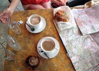 Walking in France: Checking a map over second breakfast