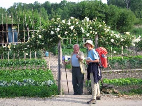 Walking in France: Discussing a vegetable garden with a local
