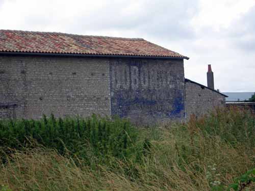 Walking in France: An ancient Dubonnet sign on the side of a barn