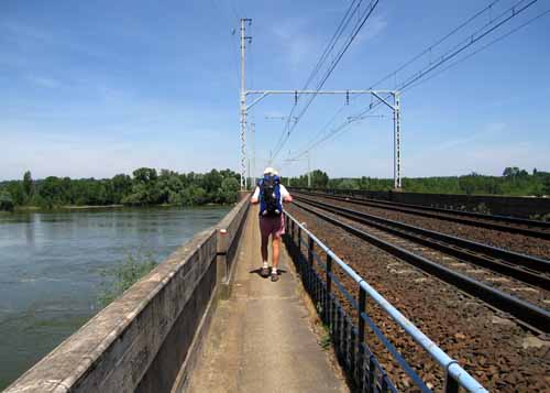 Walking in France: Crossing the Loire on a railway bridge (with GR sign)
