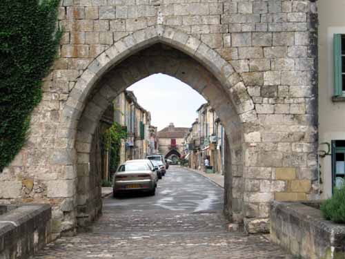 Walking in France: Looking back to the centre of Montpazier through a town gate