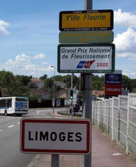 Walking in France: Not many flowers visible at the entrance of a town that was the grand prize winner for flowers in 2002
