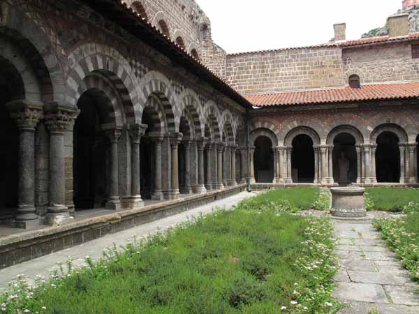 Walking in France: The disappointing cloisters, choked with a few scruffy perennials, le Puy