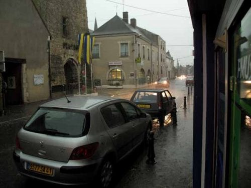 Walking in France: The main street of Mennetou during the downpour