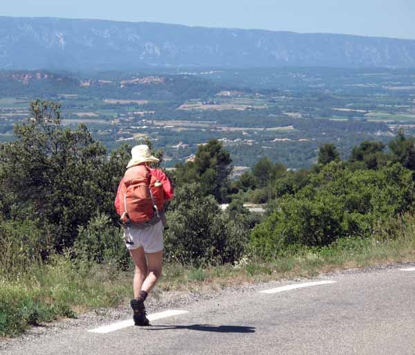 Walking in France: The start of the descent to St-Saturnin, with the Grand Luberon and Roussillon in the distance