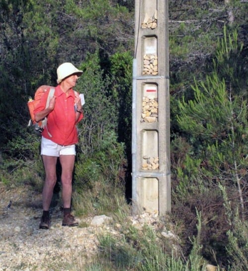 Walking in France: A power pole laden with pilgrim stones