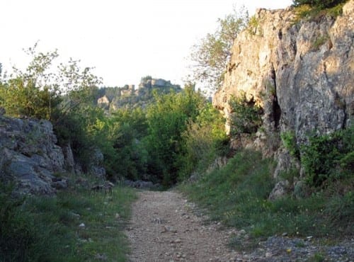 Walking in France: Walking back to the boulangerie, with the ruined fortress on the hill