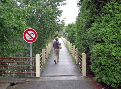 Walking in France: Returning to town over a footbridge 