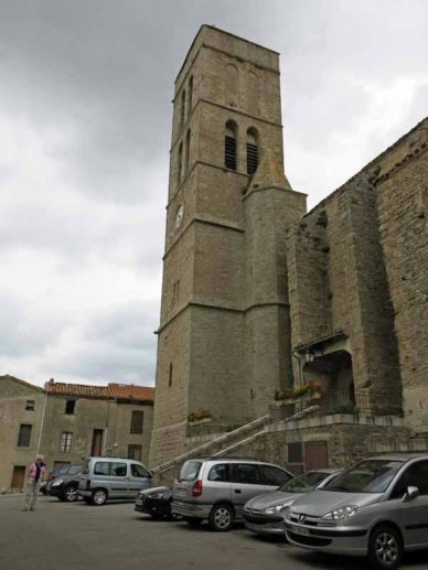 Walking in France: Dark clouds over the church, Trèbes