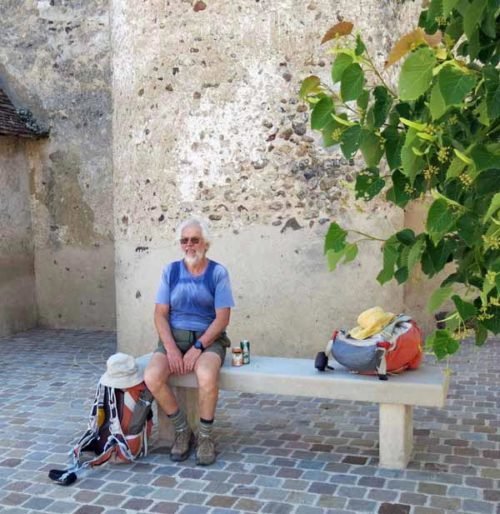 Walking in France: Cold drinks and pizza in front of Mézilles' church 