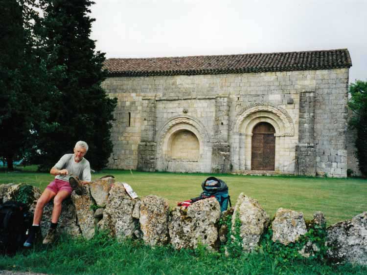 Walking in France: Removing the gluant sol from our boots at the chapel of Abrin