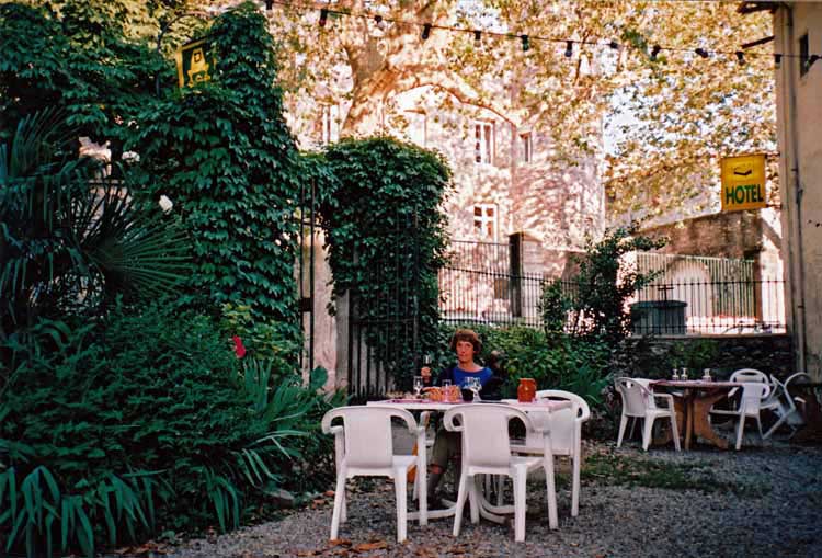 Walking in France: Dining in Avèze with the 11th century chateau in the background