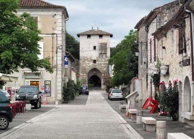Walking in France: Looking towards a portal from the main square, Vianne