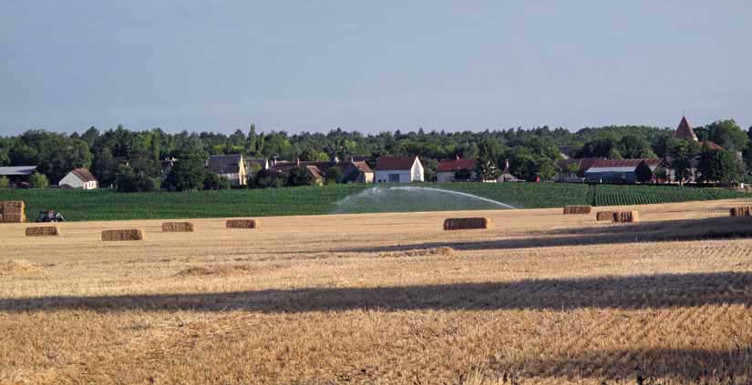 Walking in France: Fields of hay and corn with Corquoy in the distance