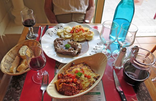 Walking in France: Our main courses; a lasagne, and steak with green peppercorn sauce and gratin dauphinois