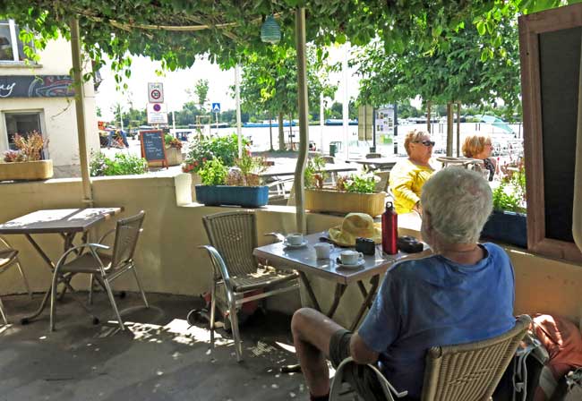 Walking in France: A shady bar by the river