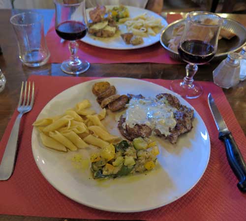 Walking in France: And our mains; steak with Roquefort sauce, and a veal brochette