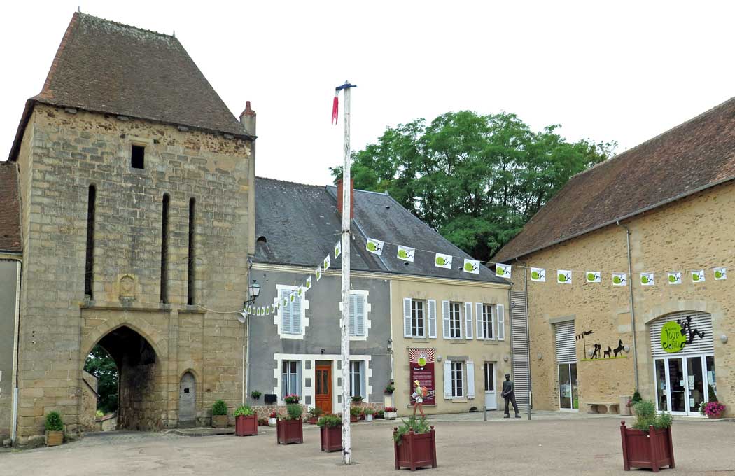 Walking in France: The entrance to the château, the Maison Jacques Tati, the Maison du Jour de Fête, and another statue of the postman