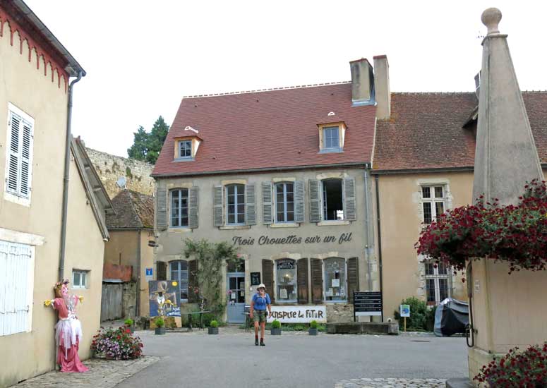 Walking in France: The main square of Verneuil-en-Bourbonnais with scarecrow