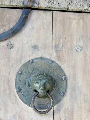 Walking in France: A door knocker on the basilica of St-Julien, Brioude