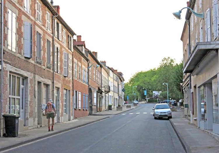 Walking in France: Heading to an early breakfast, with the Royal Domain of Randan in the distance